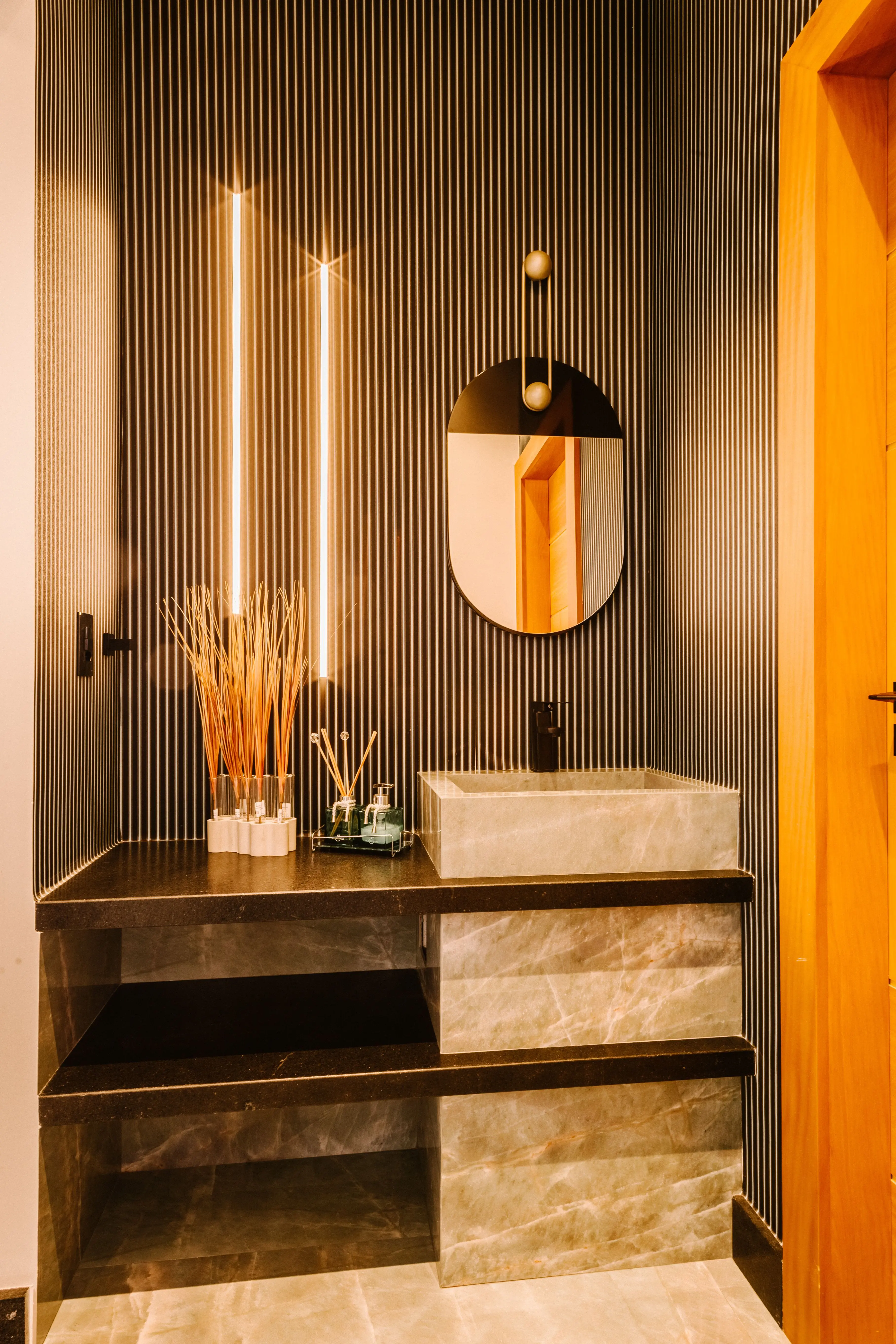 A single elegant vanity and mirror nook inside a shared salon suite