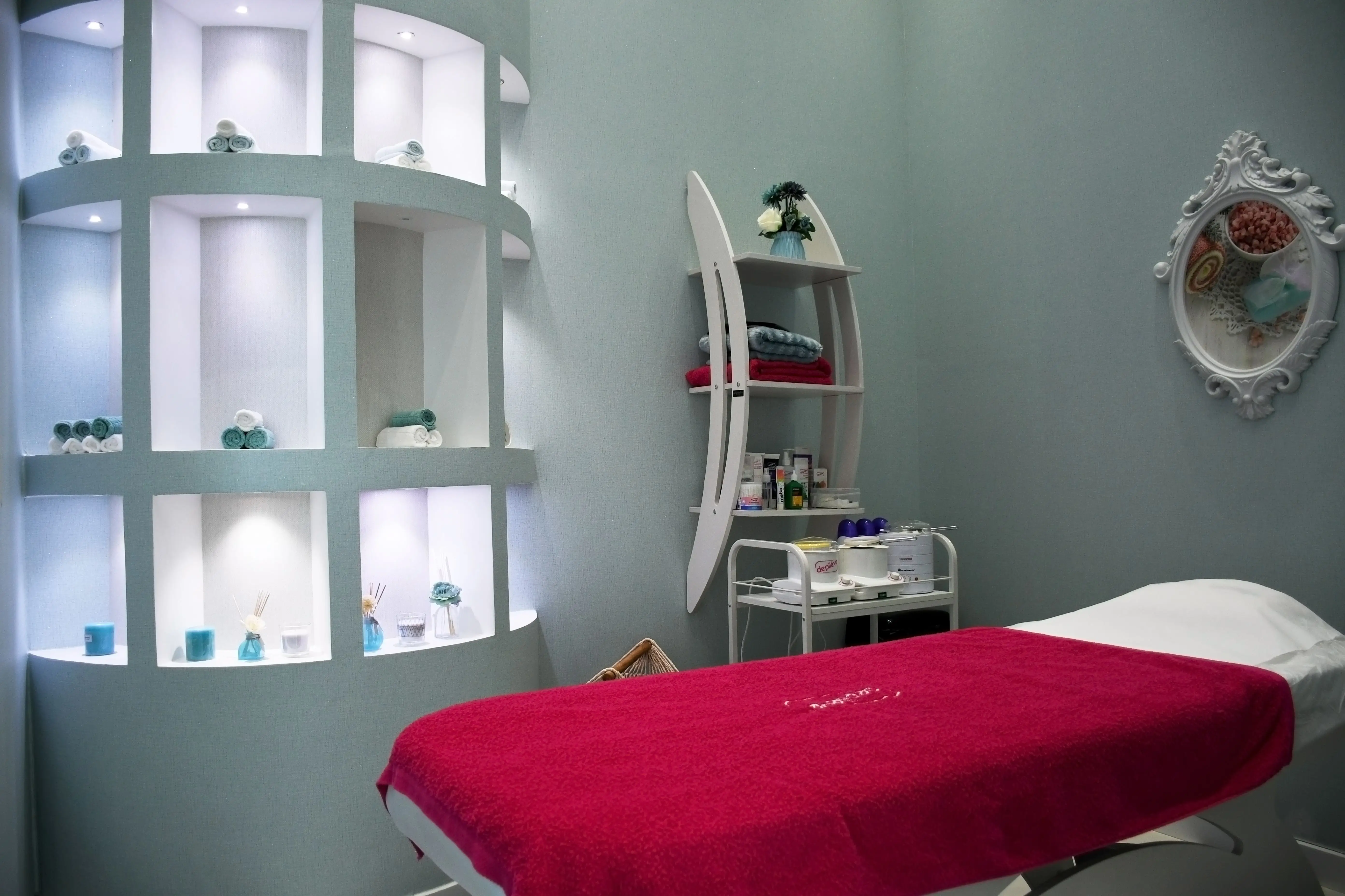 A real spa treatment room with a massage table, ready for a client